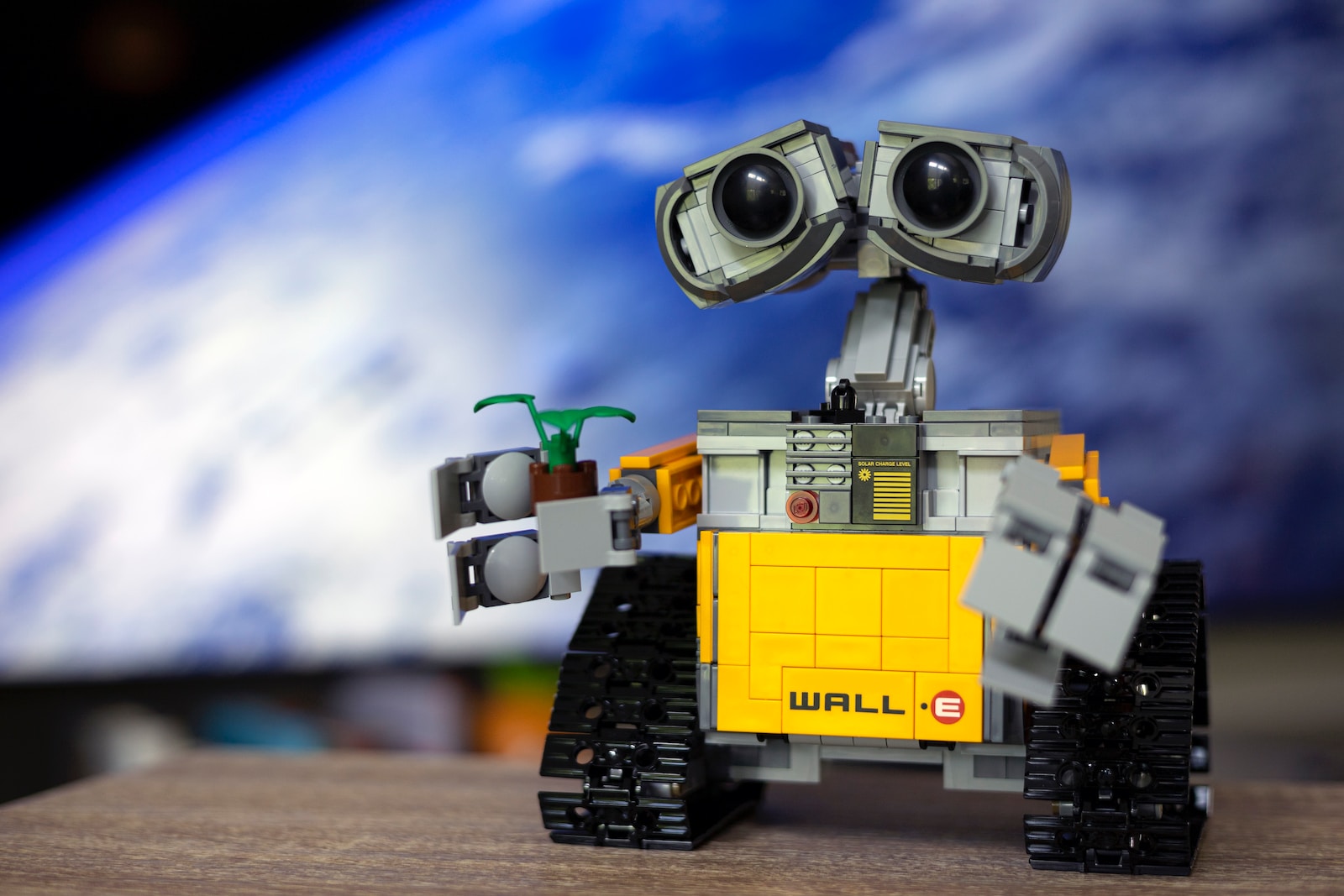 a lego robot with two eyes and a camera